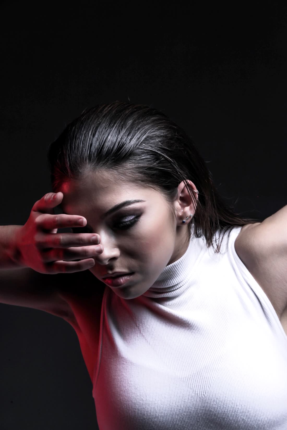 Megan Goldstein, studio portrait in dramatic red light