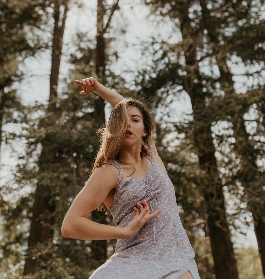 Megan dancing among the trees